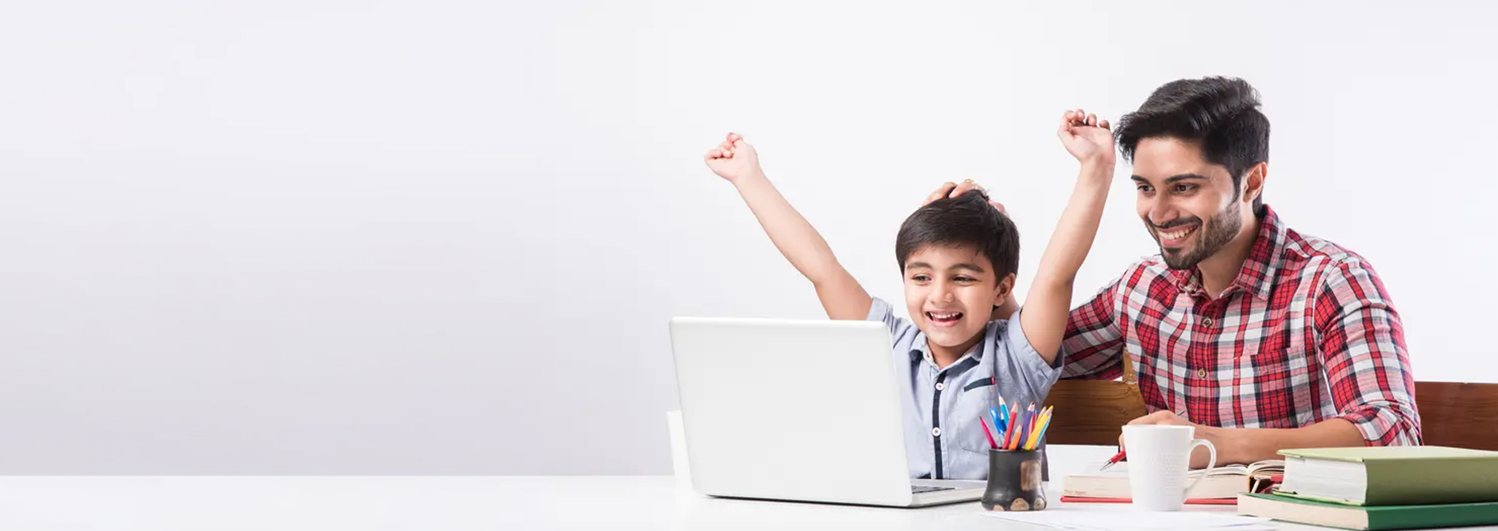 Father and son celebrating a learning win